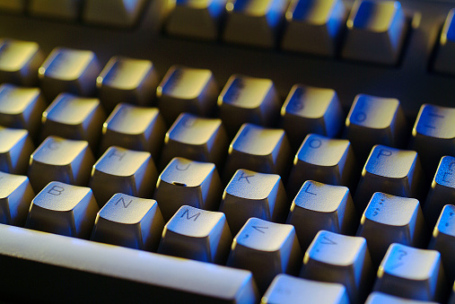 White gamer keyboard with colorful lights.