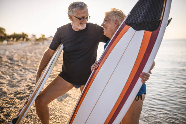 istock Active senior couple at the beach 1412952540