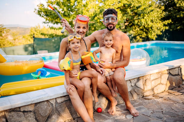 istock Family at the pool 1412953062