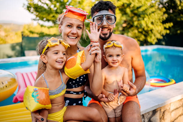 istock Family at the pool 1412953657