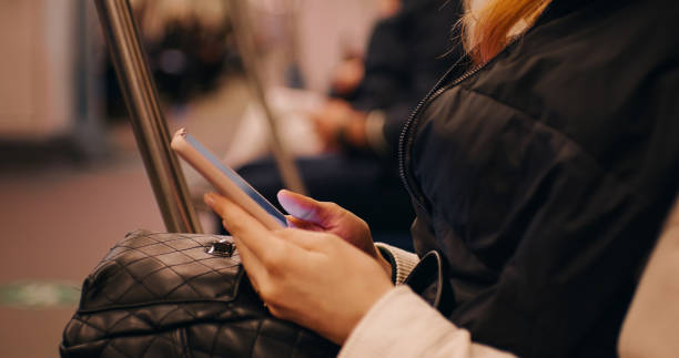 istock Passenger using technology phone in subway for travel. 1412954035