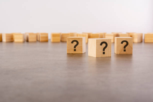istock front view on many wood cubes with question marks. many question arising concept 1412955049
