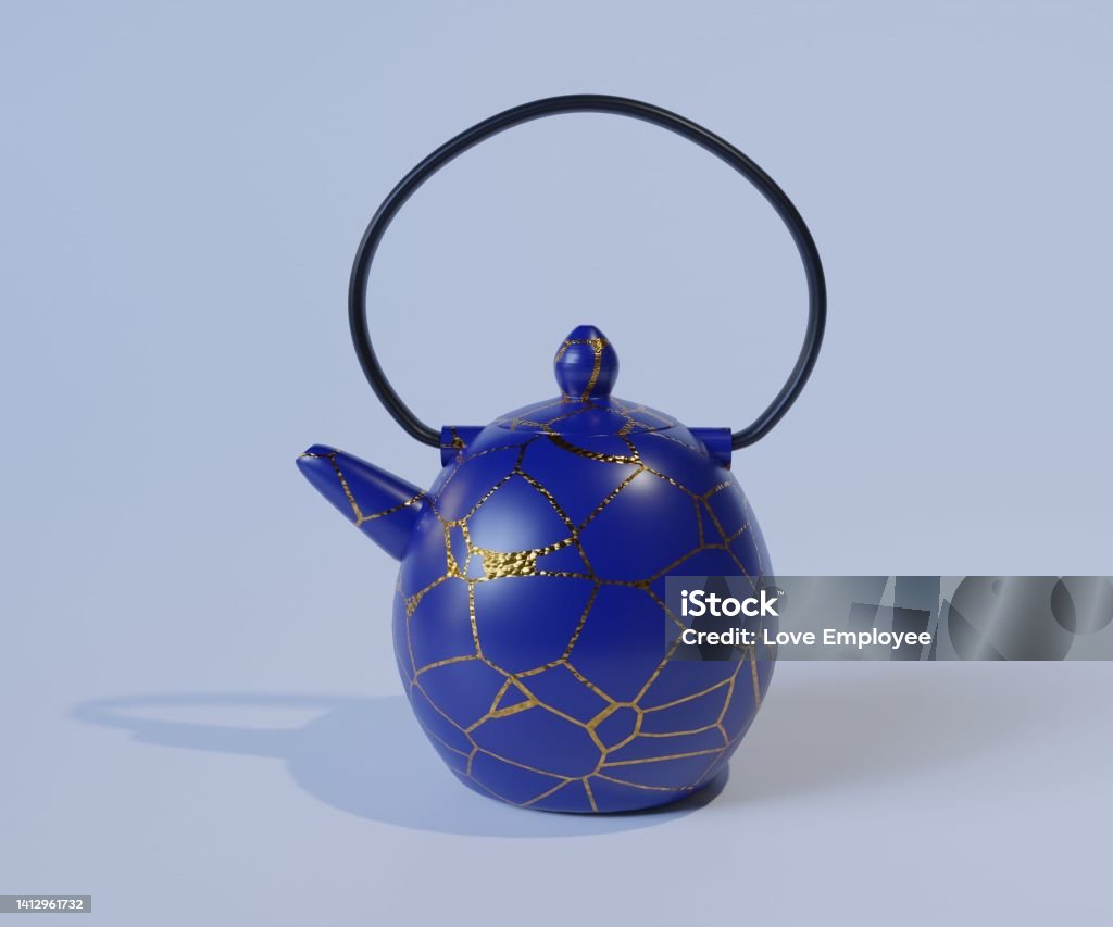 Ceramic Teapot. Kintsugi is the Japanese art of repairing broken pottery Ceramic Teapot. Kintsugi is the Japanese art of repairing broken pottery by mending the areas of breakage with lacquer dusted or mixed with powdered gold Kintsugi Stock Photo
