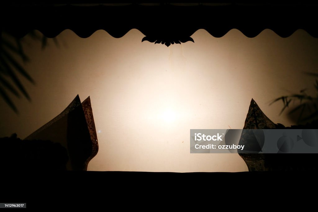 Javanese gunungan wayang or shadow puppet in the screen Puppet Stock Photo