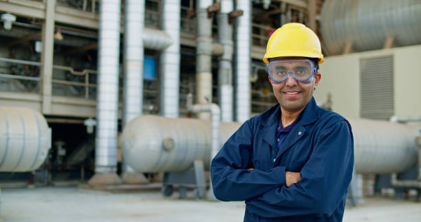 istock Industrial Technician Smiling at Camera and Crossing Arms 1412964727