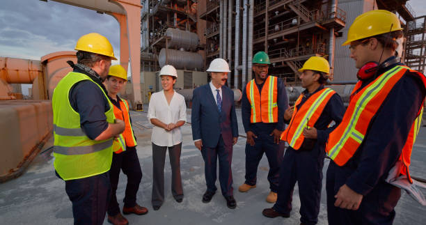 istock Managers or Politicians Speaking with Power Plant Workers 1412964767