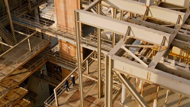 istock Engineers on Rusty Walkways at Gas Fired Power Plant - Aerial 1412965396