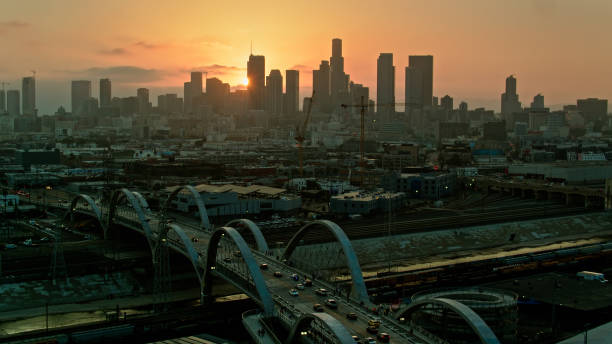 istock Sun Setting Between DTLA Buildings from Over Sixth Street Bridge - Aerial 1412967162