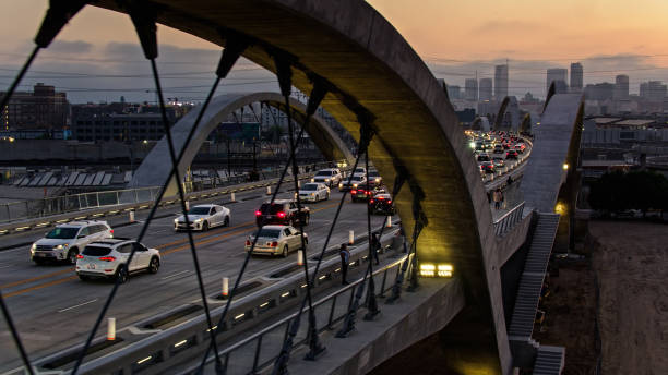 Aerial View of Rush Hour Traffic on Sixth Street Bridge in Los Angeles, California Aerial shot of the new Sixth Street Viaduct connecting  the Downtown Los Angeles Arts District to Boyle Heights across the Los Angeles River. sixth street bridge stock pictures, royalty-free photos & images