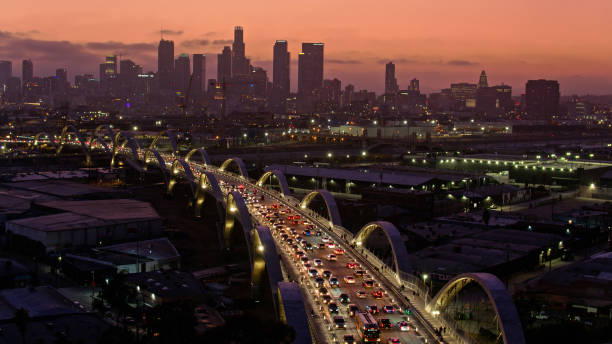 Aerial Shot of Early Evening Traffic On Sixth Street Bridge Aerial shot of the new Sixth Street Viaduct connecting  the Downtown Los Angeles Arts District to Boyle Heights across the Los Angeles River. sixth street bridge stock pictures, royalty-free photos & images