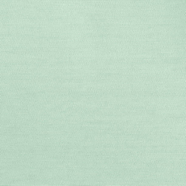 Silk fabric texture pattern background in light pale blue mint lime green teal color tone