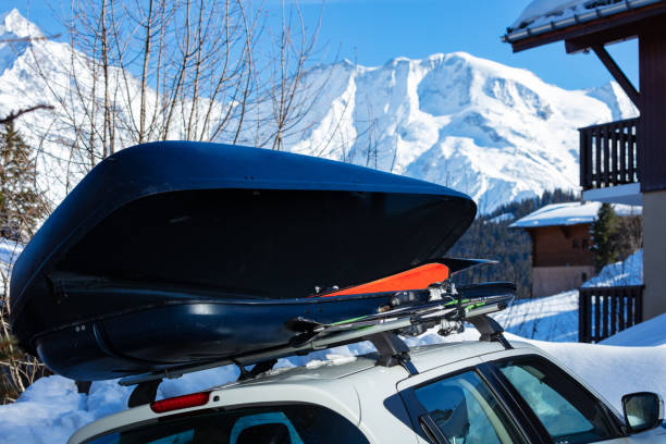 istock Car box on the roof with ski inside over mountain peaks 1412972606