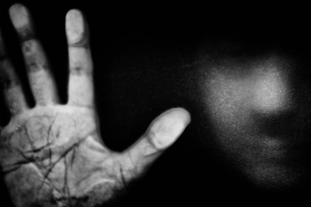 Dramatic black and white image of Hand with Fingers Splayed emoji isolated on black background