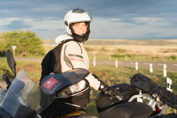 istock motorcyclist woman 1412974374