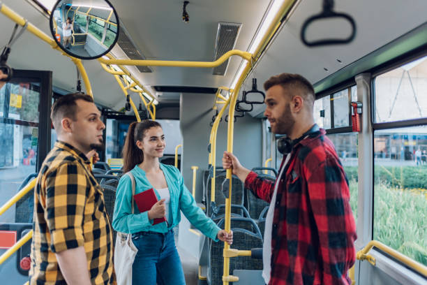 istock Group of friends talking while riding in a bus 1412974541