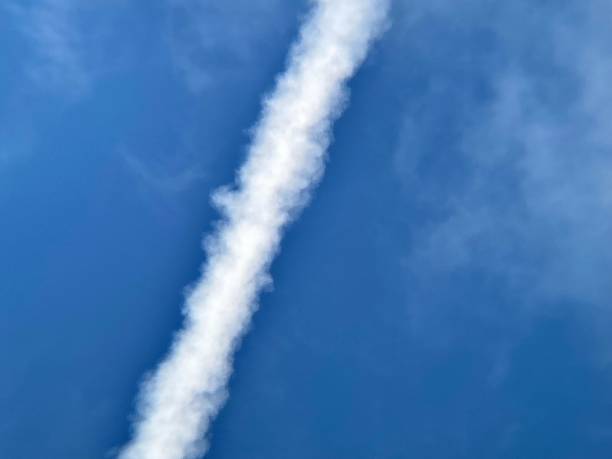 istock Contrails atavistic a blue cloudy sky 1412976142