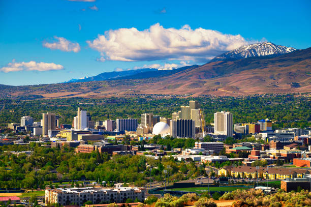 Downtown Reno skyline, Nevada, with hotels, casinos and surrounding mountains stock photo