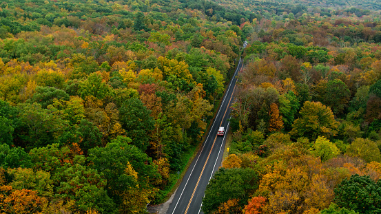 Aerial shot of woodlands and fall colors in the township of Montague, New Jersey on an overcast day. The township is the most northern town in New Jersey and known as the \