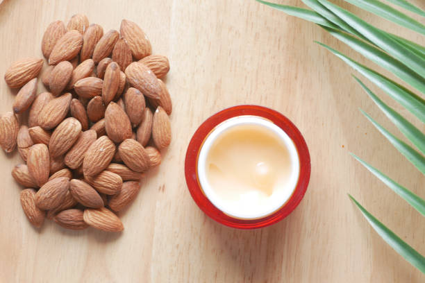 istock almond nuts and beauty cream on table 1412982916