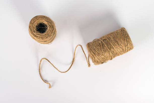 istock Top view of two skeins with a rope on a white background. 1412988548