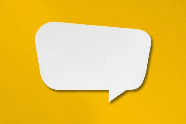 istock speech balloon shape white paper isolated on yellow background 1412991758