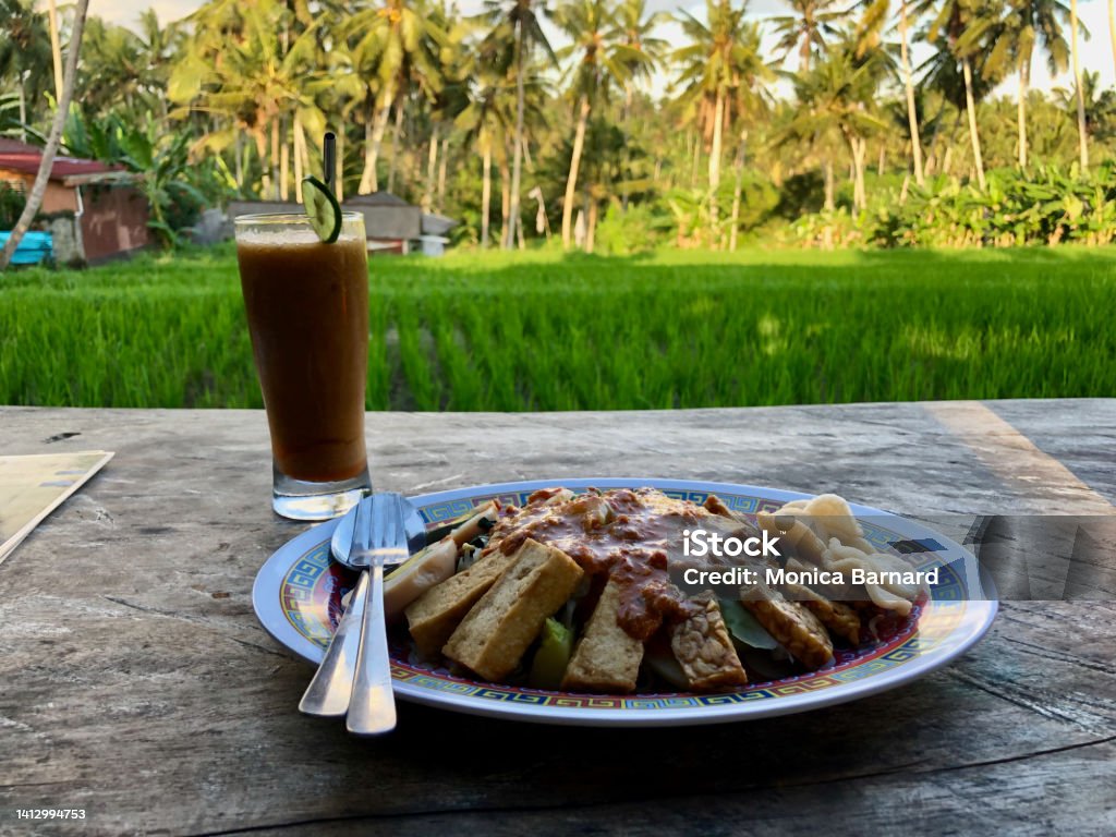 Vegetarian hodgepodge Indonesian food overlooking rice field Balinese Culture Stock Photo