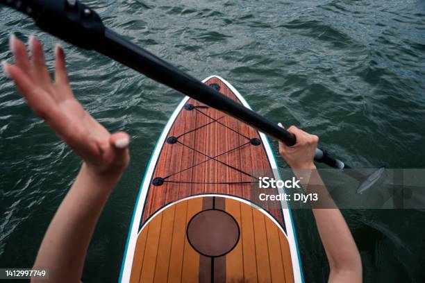 Sports Girl On Board For Glanders Surfing A Young Slender Woman Floats On A Board With A Paddle Surfing Summer Fun On The Water Healthy Lifestyle Sup On Calm Water Top View Stock Photo - Download Image Now