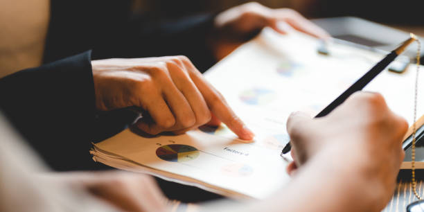 istock business approve and certificate concept, confirmation of business marketing document permit and certified stamping, signing on business partner paper to success, or concept of attorney and insurance 1412997768