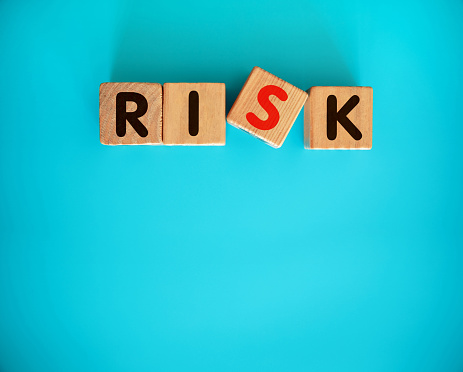 RISK word on wooden block