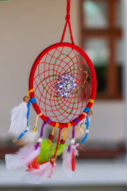 istock Dream catcher with feathers threads and beads rope hanging. Dreamcatcher handmade 1413002356