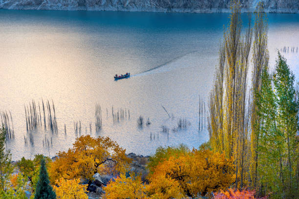 istock autumn landscape with snow covered mountains 1413008762