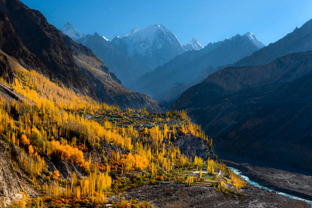istock autumn landscape with snow covered mountains 1413008949