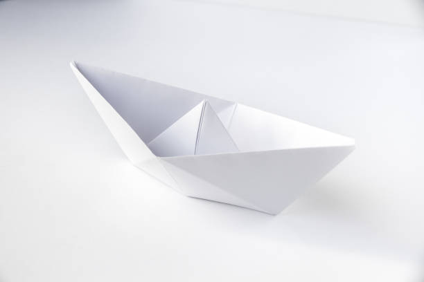 istock Paper boat origami isolated on a white background 1413011836