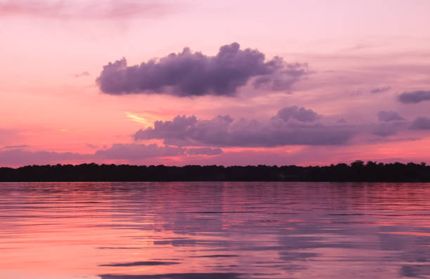coral skies sunset - color image light pink dramatic sky imagens e fotografias de stock