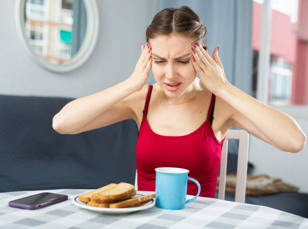 istock Upset woman crying while sitting at the table in room 1413016791