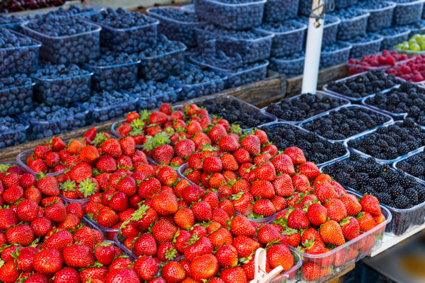 istock Fresh summer blueberries and strawberries on summer market 1413021965