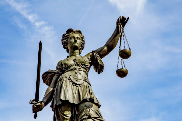 istock Justitia - Lady Justice . sculpture at the Roemerberg in Frankfurt 1413022921