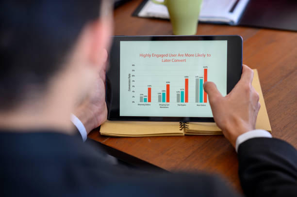istock Cropped shot of a businessman using a digital tablet in a modern office 1413023485