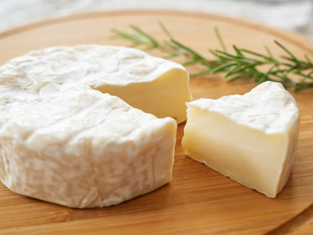 istock Camembert cheese on the wooden board 1413025471