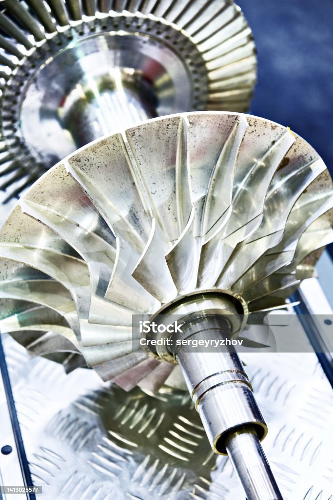 Turbine shaft with impeller Metal turbine shaft with impeller Color Image Stock Photo