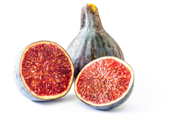 Fresh cut ripe fig fruit isolated on white background stock photo