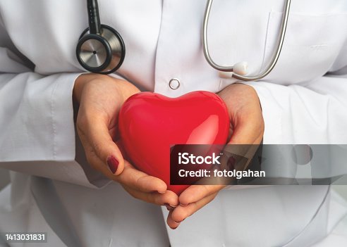 istock Medicine doctor holding red heart shape in hand, medical concept stock photo 1413031831