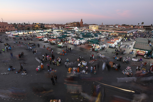 Marrakesh, Morocco - October 29, 2021: People in Jemaa el-Fnaa where main square of Marrakesh, used by locals and tourists