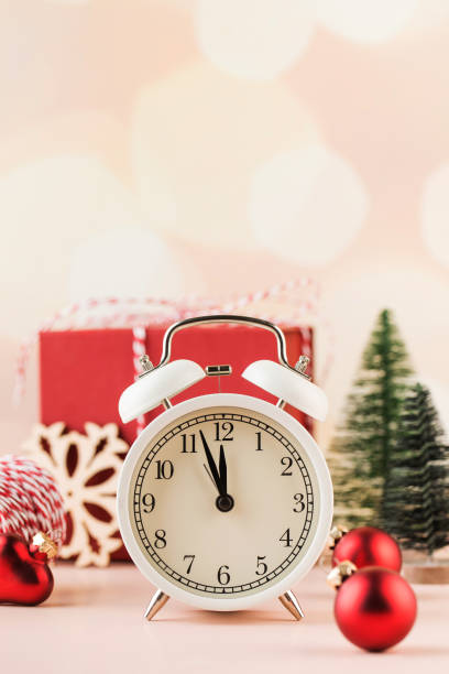 istock Christmas composition with holiday decorations, alarm clock and gift box. 1413033271
