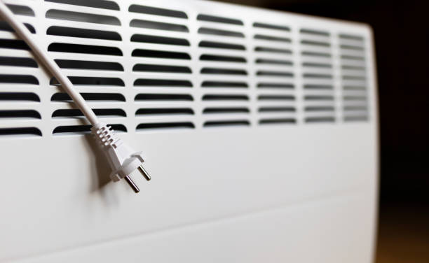 istock Electrical plug on a heater, saving energy, save power, heating season concept 1413034243