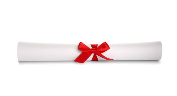 istock Rolled student's diploma with red ribbon isolated on white 1413037442