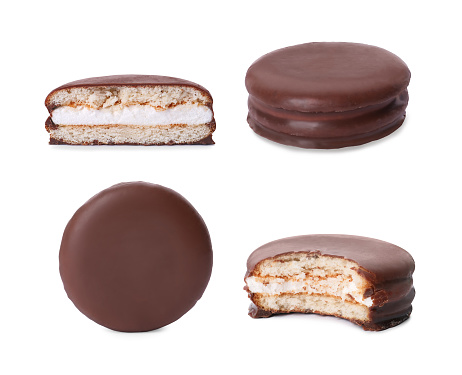 Set with tasty choco pies on white background