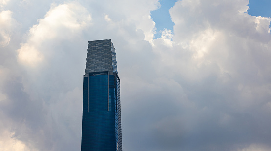 Kuala Lumpur, Malaysia -  June 14, 2022: Dark rain clouds moving over the Exchange 106 skyscraper. The TRX or signature tower. Symbol of 1MDB and Tun Razak Exchange financial crisis . Iconic building