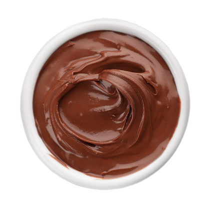 Bowl of chocolate paste isolated on white, top view