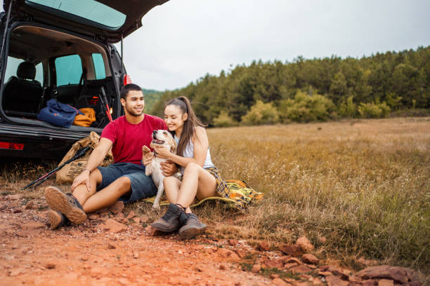 istock Couple enjoy with dog in nature 1413039111